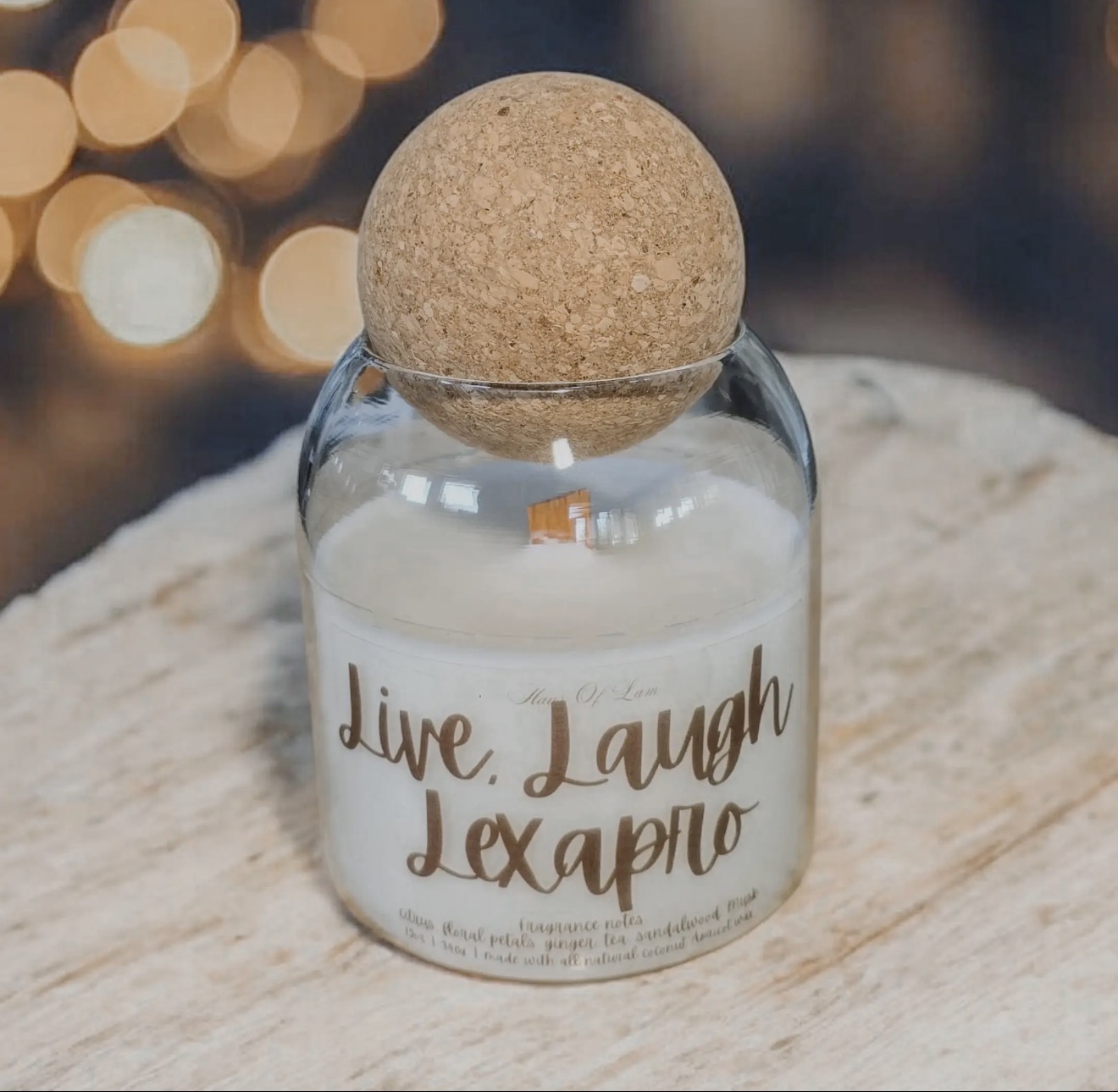 Live, Laugh, Lexapro candle in a glass jar with a round cork lid
