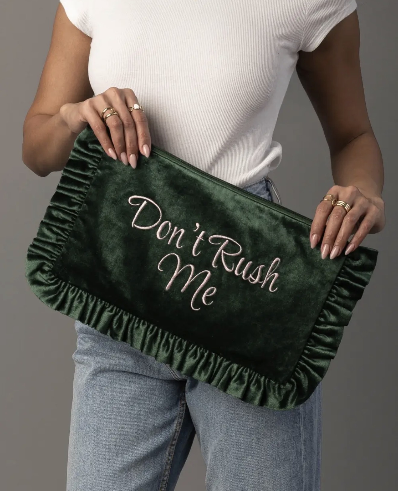 Forest green ruffled velvet pouch embroidered with Don’t Rush Me