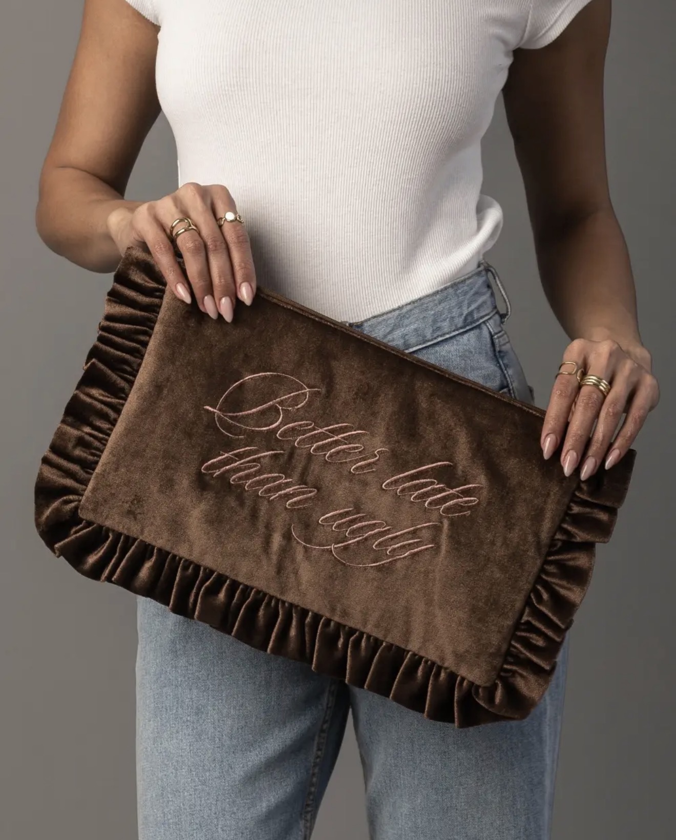 Brown ruffled velvet pouch embroidered with Better Late Than Ugly